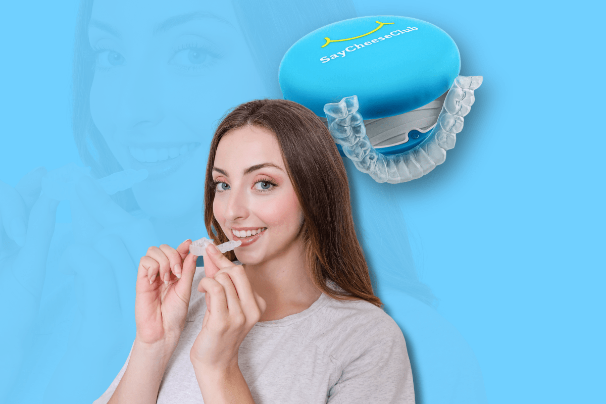 A smiling woman holds a clear dental aligner near her mouth against a blue background. Above, a